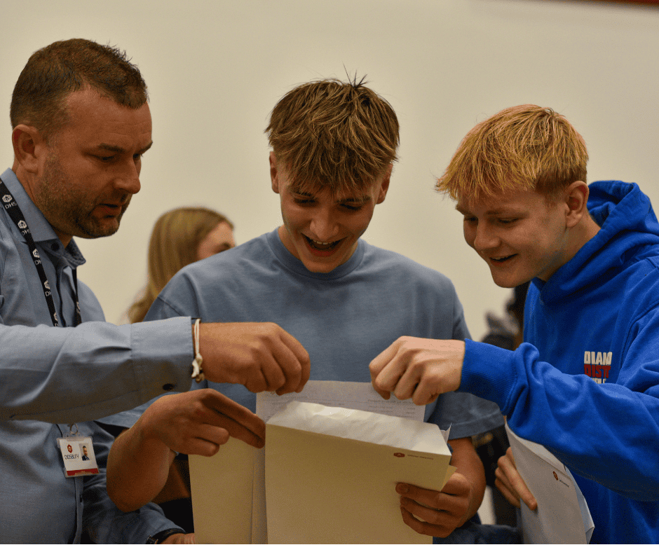 Didsbury High School students pictured opening their GCSE results with staff. 