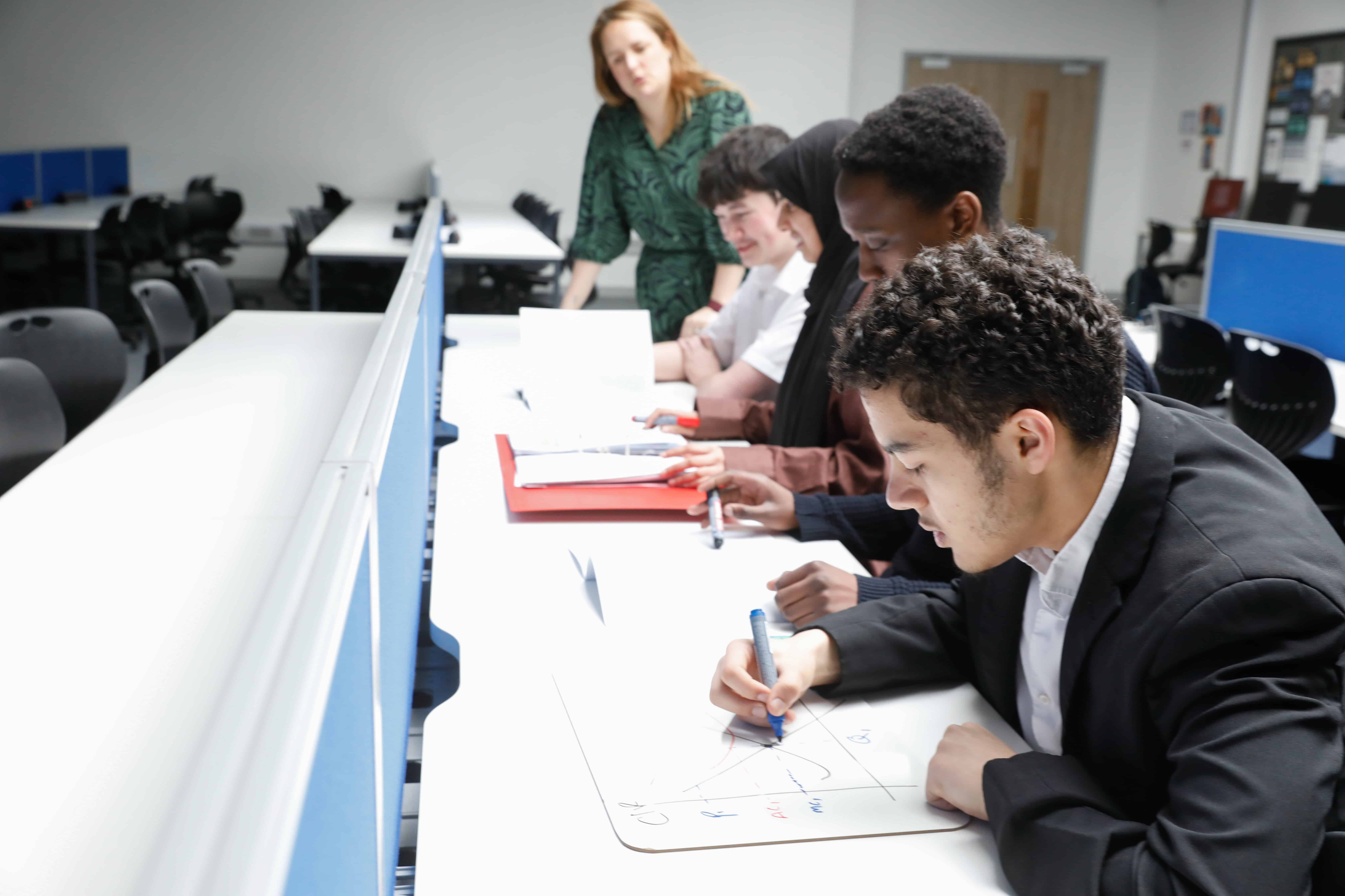 Students at Didsbury Sixth Form in focused study.